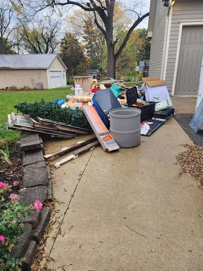 Dumpster being loaded with debris for 3 Yard Dumpster Rental in Thurmont